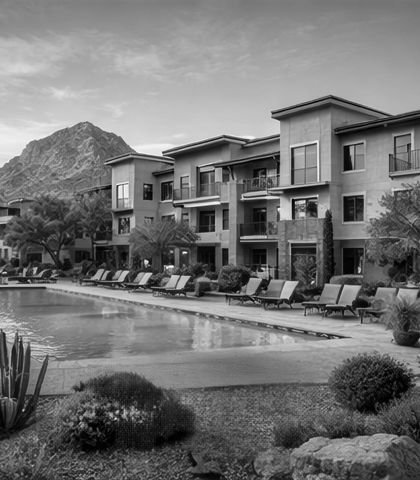 A view of pool, an establishment and a mountain