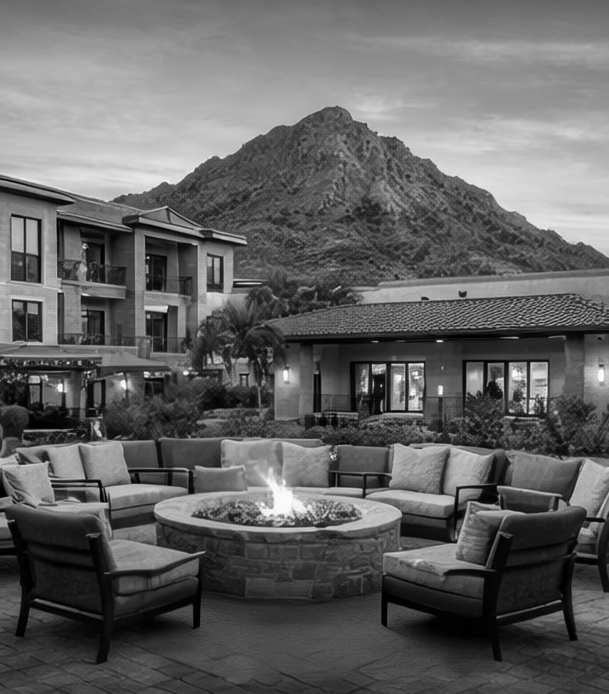 An outdoor view of a house with mountain in the background